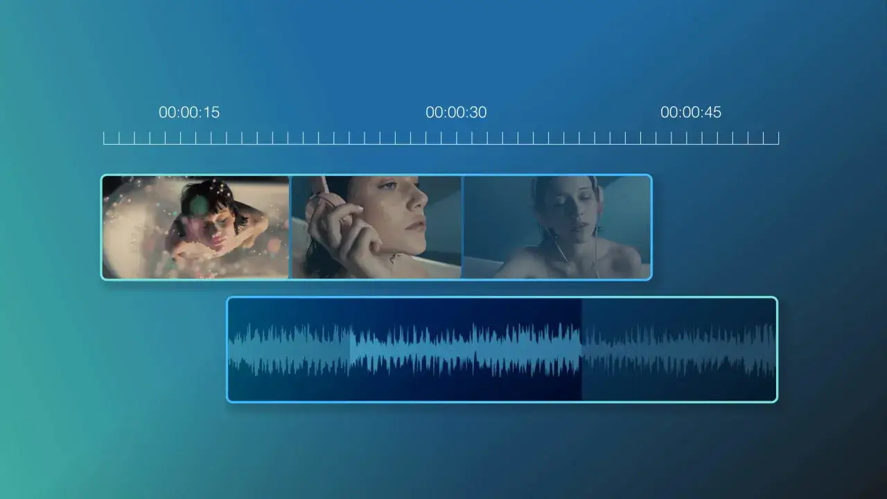 Edytor wideo z miniaturami klipów i ścieżką dźwiękową. Widać efekt fade-out na końcu dźwięku.